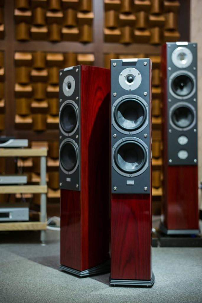 Luxury wooden speakers in an acoustically optimized room, perfect for audiophiles.